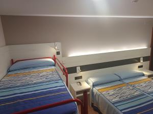 Ένα ή περισσότερα κρεβάτια σε δωμάτιο στο Hostal Restaurante El Castillo