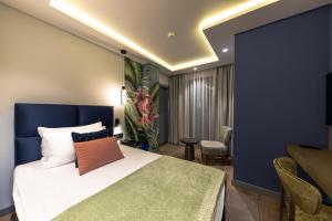 Vuode tai vuoteita majoituspaikassa Calisi Hotel