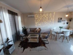 a living room with a couch and a table at Quintana Apartment in Mendoza