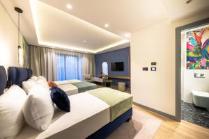 Vuode tai vuoteita majoituspaikassa Calisi Hotel