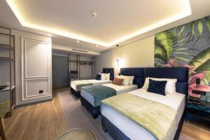 Vuode tai vuoteita majoituspaikassa Calisi Hotel