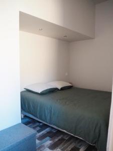 a bedroom with a bed in a room at Maison Salamandre in Remoulins +8 photos