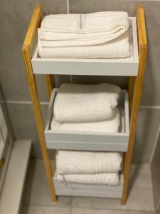 a towel rack with towels in a bathroom at Outer Space - 1 bedroom Luxurious Apartment in Sandton in Sandown