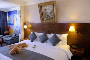 Een bed of bedden in een kamer bij Washington Hotel