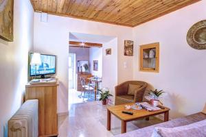 a living room with a couch and a table at Vavilato Home Kouramades in Kouramádes