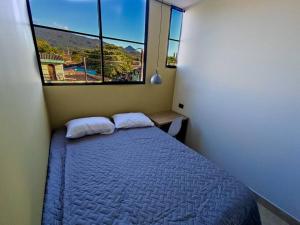 Postel nebo postele na pokoji v ubytování Acogedor Depto. en el corazón Santa Tecla