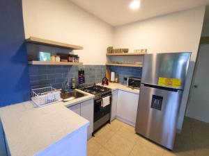 Kuchyň nebo kuchyňský kout v ubytování Acogedor Depto. en el corazón Santa Tecla + 15 fotografií