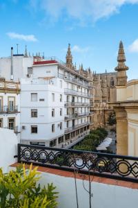 a view from the balcony of a building at HomeySeville-Amazing Views Cathedral Tomas de Ibarra - 8 pax, Parking Optional in Seville