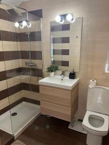 a bathroom with a sink and a shower and a toilet at Kobentu Berri by Smiling Rentals in Hondarribia