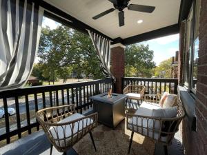 a porch with chairs and a table on a balcony at Midtown Casablanca in Memphis