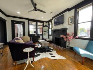 a living room with a couch and a fireplace at Midtown Casablanca in Memphis