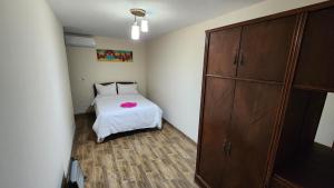 A bed or beds in a room at Alex sea view apartment - families only