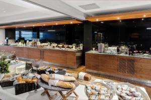 a bakery with a buffet of food on display at Best Western Plus Airport Hotel in Copenhagen