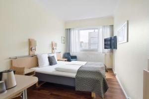 TV a/nebo společenská místnost v ubytování Best Western Plus Airport Hotel