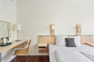 Postel nebo postele na pokoji v ubytování Best Western Plus Airport Hotel