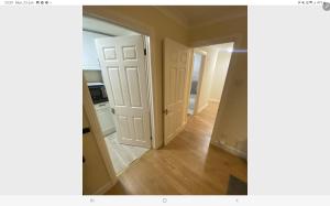 an empty room with a door and a mirror at One bed flat in Southampton