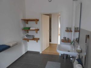 a white bathroom with a sink and a mirror at Apartments in Fischbach bei Dahn - Pfälzerwald 42914 in Fischbach