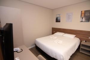 Postel nebo postele na pokoji v ubytování Hotel Maua