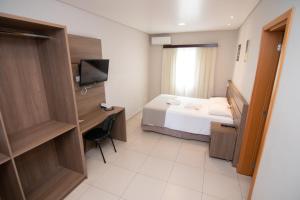 Postel nebo postele na pokoji v ubytování Hotel Maua