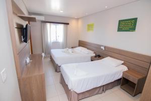 Postel nebo postele na pokoji v ubytování Hotel Maua