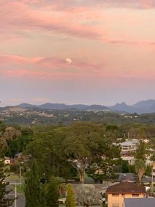 a view of a city with the moon in the sky at Slice of Heaven at Number 7, privacy and views in Tweed Heads