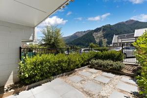 a balcony with a view of the mountains at Central town apartment in Queenstown
