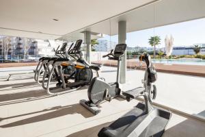 a gym with three cardio machines in a building at Remarkable 3 bedroom Apartment in Eivissa in Ibiza Town