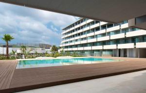 a swimming pool in front of a building at Remarkable 3 bedroom Apartment in Eivissa in Ibiza Town