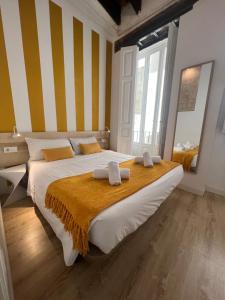 Posteľ alebo postele v izbe v ubytovaní Baron Suites Reina