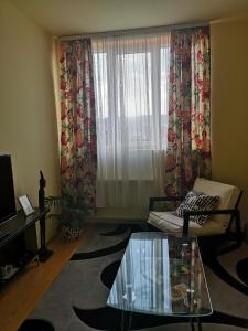 a living room with a couch and a window at Apartman Stanimirović in Zaječar