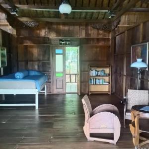 Ένα ή περισσότερα κρεβάτια σε δωμάτιο στο Havana Horses Lodge