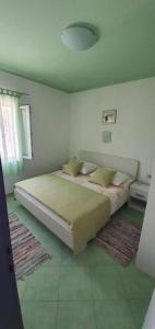 a bedroom with a large bed in a room at Apartment in Sevid with Seaview, Terrace, WIFI (4746-2) in Sevid