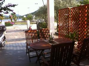 a wooden table and chairs on a patio at Villa Mali Ston (3588) in Mali Ston +58 photos
