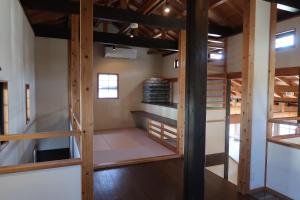 a room with wooden stairs in a house at Kuranoyado Matsuya in Fujikawaguchiko