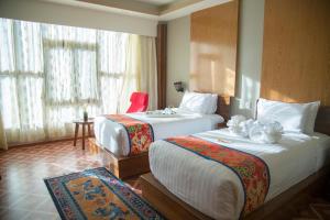 Postel nebo postele na pokoji v ubytování Tara Phendeyling Hotel + 37 fotografií