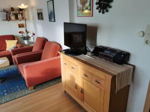 TV a/nebo společenská místnost v ubytování Haus Juist - Schillig