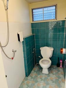 a bathroom with a toilet and a shower at 146 Canal in Bangkok