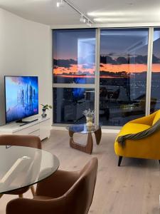 a living room with a view of a city at Melbourne CBD Apt with Free Car Park Ocean View in Melbourne