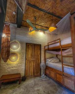 a room with two bunk beds and two lights at Sa Sa Lao in Luang Prabang