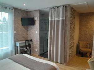 Postel nebo postele na pokoji v ubytování Chambre d'hôtes Les Bruyères