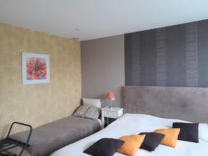 Postel nebo postele na pokoji v ubytování Chambre d'hôtes Les Bruyères