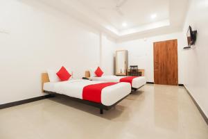 Postel nebo postele na pokoji v ubytování Super Hotel O Sakthi Grand