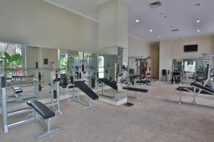a gym with several treadmills and machines in a room at Riss Hotel Malioboro in Yogyakarta