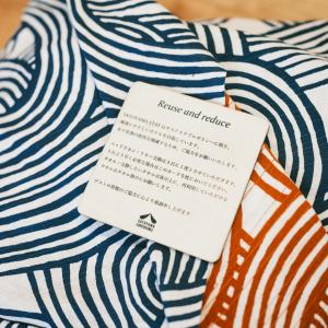 a white and blue striped tie with a note on it at SATOYAMA STAY Nino-Machi in Furukawachō