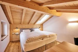 Voodi või voodid majutusasutuse Hotel Garni Sursilva toas