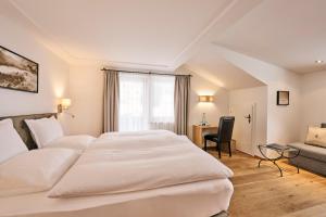 Voodi või voodid majutusasutuse Hotel Garni Sursilva toas
