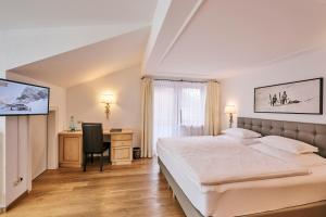 Voodi või voodid majutusasutuse Hotel Garni Sursilva toas