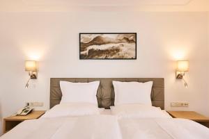 Voodi või voodid majutusasutuse Hotel Garni Sursilva toas