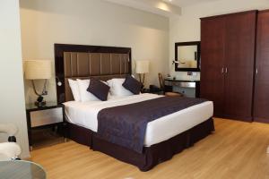 Cama o camas de una habitación en Premium Strato Hotel