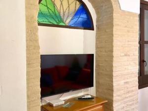 Televízia a/alebo spoločenská miestnosť v ubytovaní Buhardilla de Wallada Córdoba